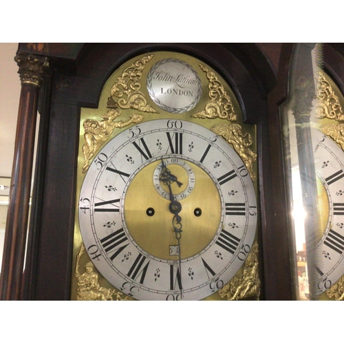 1320 - A Georgian mahogany long case clock the arched dial second subsidiary dial and date aperture. John L... 