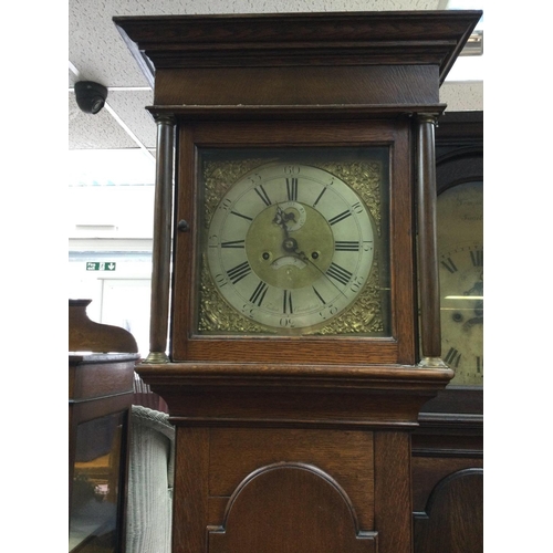 1337 - A oak eight day long case clock the brass dial with Roman numerals Foden Congleton