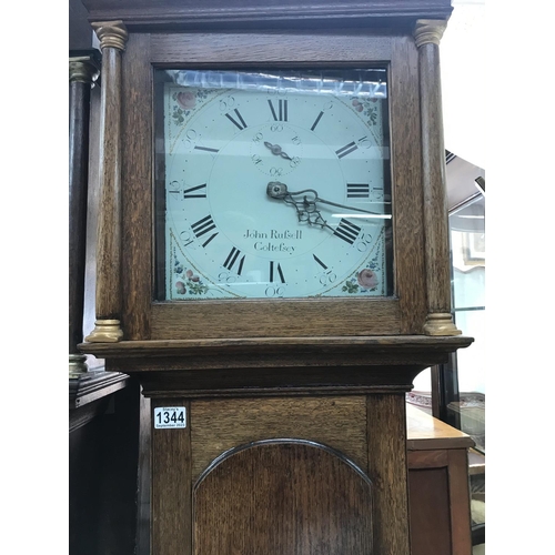 1344 - A oak long case clock the enamel painted dial with Roman numerals, John Rufsell , Coltefsey .