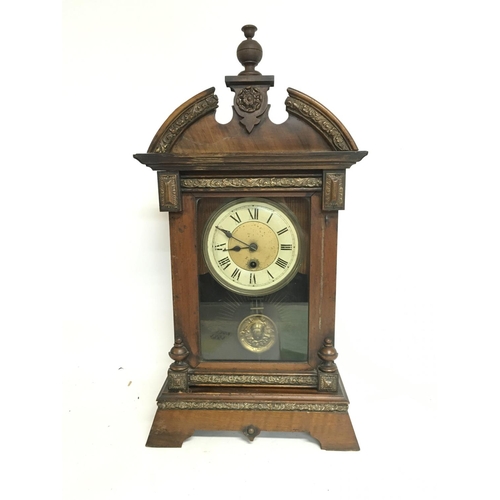 1351 - A Continental wall clock (needs restoring) and one other walnut clock, with keys postage category D