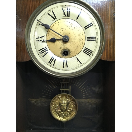 1351 - A Continental wall clock (needs restoring) and one other walnut clock, with keys postage category D