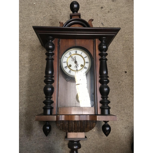 1351 - A Continental wall clock (needs restoring) and one other walnut clock, with keys postage category D