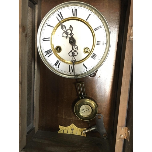 1351 - A Continental wall clock (needs restoring) and one other walnut clock, with keys postage category D