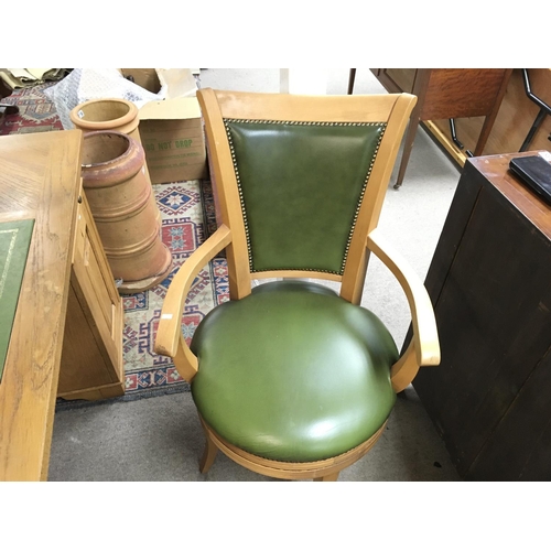 1366 - An oak pedestal desk with green leather centre and matching chair. Desk is approx 150cm wide by 70 d... 