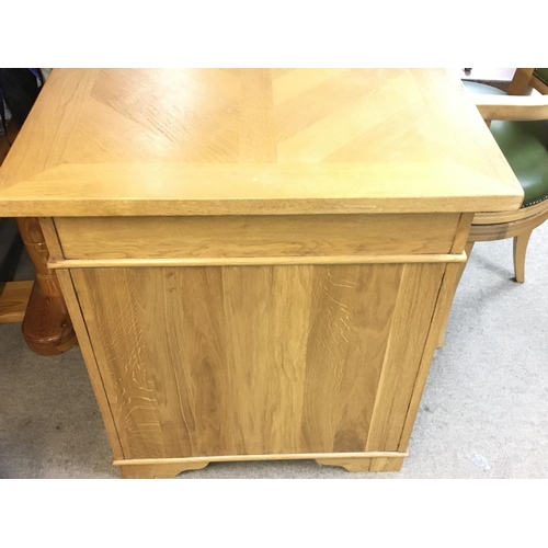 1366 - An oak pedestal desk with green leather centre and matching chair. Desk is approx 150cm wide by 70 d... 