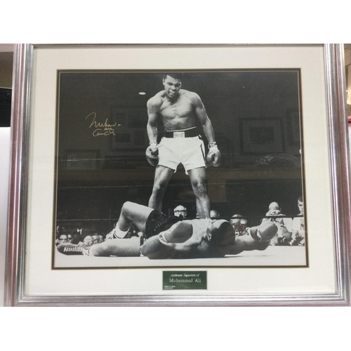 1533 - A framed and glazed signed photo of Mohammed Ali alias Cassius Clay with COA, approx 68cm x 58cm. Sh... 