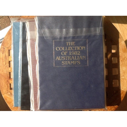 1763 - 4 Australia Year Books. 1982, 1983 and 1991 complete. 1984 empty but all stamps for 1984 included wi... 