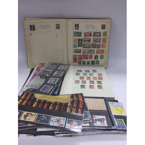 1832 - A collection of GB presentation packs, two GB stamp albums and a small collection of world stamps in... 