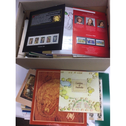 1832 - A collection of GB presentation packs, two GB stamp albums and a small collection of world stamps in... 