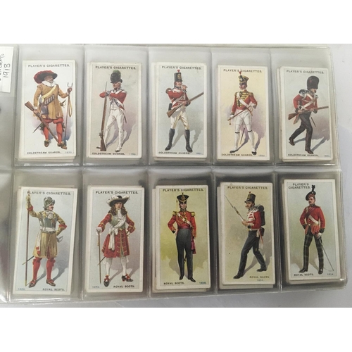 1849 - An album containing well presented Vintage cigarette cards predominantly Players cards military meda... 