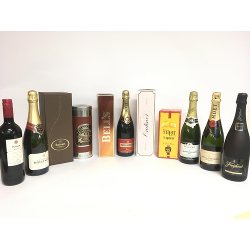 1955 - A collection of spirits, wines, champagne including Ruinart, Moet & Chandon, Bells, Bollinger, Pulia... 