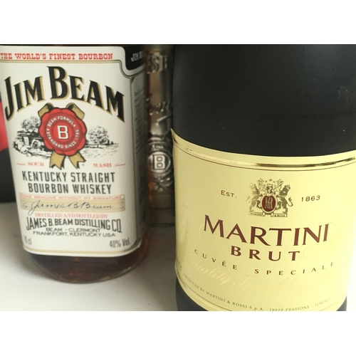 1956 - A collection of various spirits and wines including Martini Brut, Jim Bean Bourbon Whiskey, Pinot Gr... 