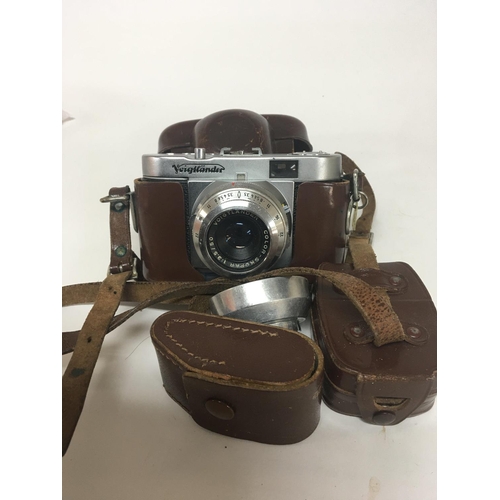 1969 - A Vintage Voigtlander Vito B camera in a fitted leather case.