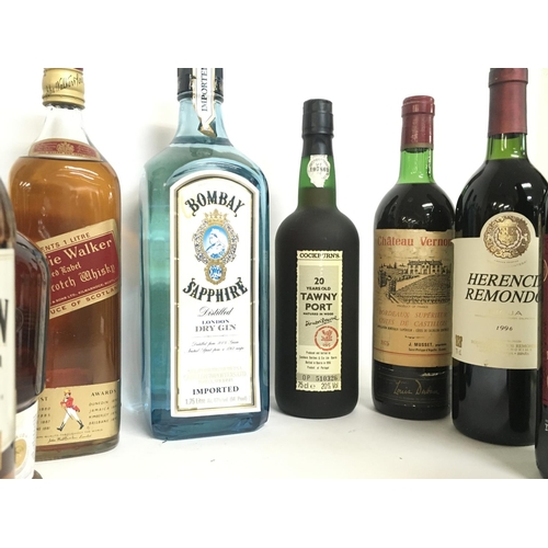 1971 - A collection of wines and spirits including Bombay Sapphire, Southern Comfort, Teachers Highland Cre... 