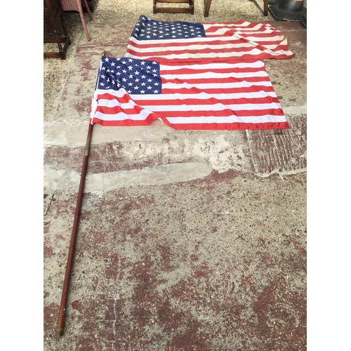 1972 - A pair of American flags, one with double a pole. Both flags approximately 142cm long