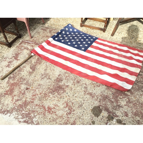 1972 - A pair of American flags, one with double a pole. Both flags approximately 142cm long