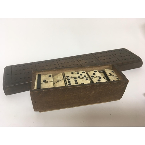 1983 - An antique bone and ebony dominoes set and a marker board (2)