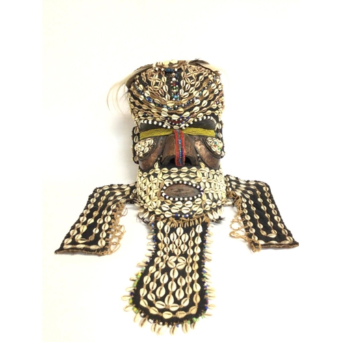 2004 - African tribal shell carved wood mask, approximately 36cm tall. Postage cat C