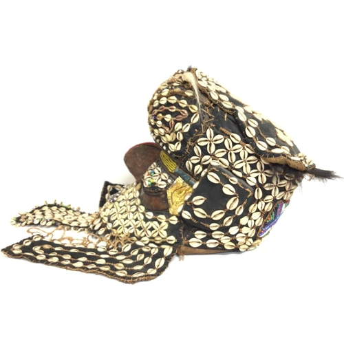 2004 - African tribal shell carved wood mask, approximately 36cm tall. Postage cat C