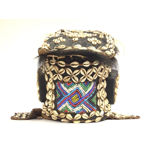 2004 - African tribal shell carved wood mask, approximately 36cm tall. Postage cat C