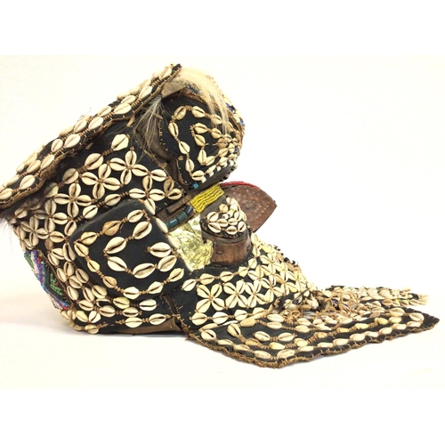 2004 - African tribal shell carved wood mask, approximately 36cm tall. Postage cat C