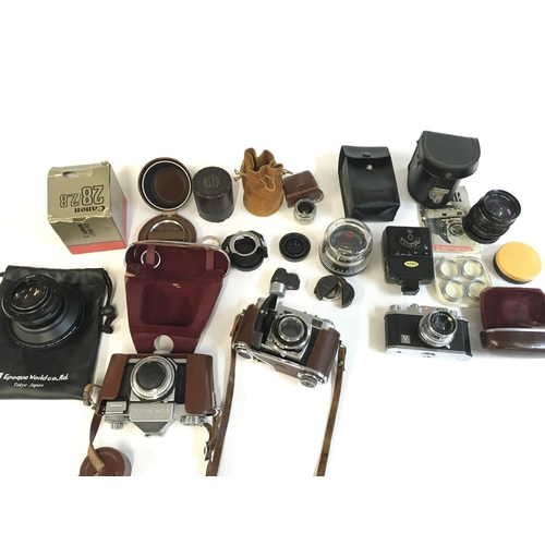 2006 - A collection of various cameras Hauna 35x contaflex Zeiss ikon four lenses and additional equipment.... 