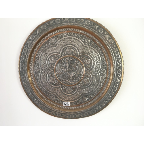 2033 - A collection of Middle Eastern and Indian brass and white metal mounted wall plaques