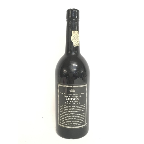 2043 - An unopened bottle of Dows 1975 Vintage Port bottled 1977, postage category D