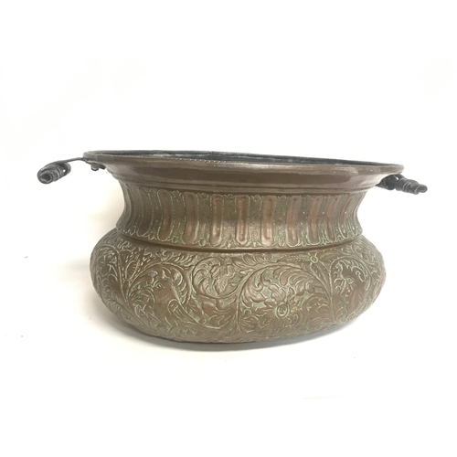 2054 - A Large vintage copper pressed planter decorated with various animals and floral patterns. 52cm wide... 