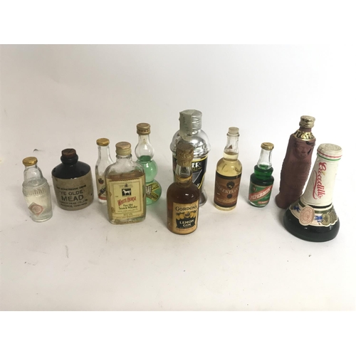 2070 - Boxed collection of miniature bottles including spirits Gordon's Lemon Gin, White Horse Scotch Whisk... 