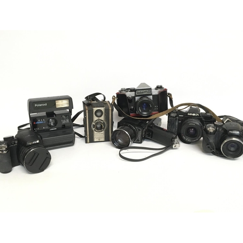 2086 - A large collection of cameras including including Minolta, Pracktica, 35mm film cameras etc. Fujiya ... 