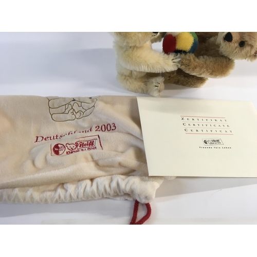 2105 - A Steiff bear limited edition. Two bears playing with a ball. Comes with cloth bag and COA. Postage ... 