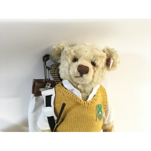 2107 - A Steiff golfer teddy bear with cloth bag. Limited Edition. Postage B.