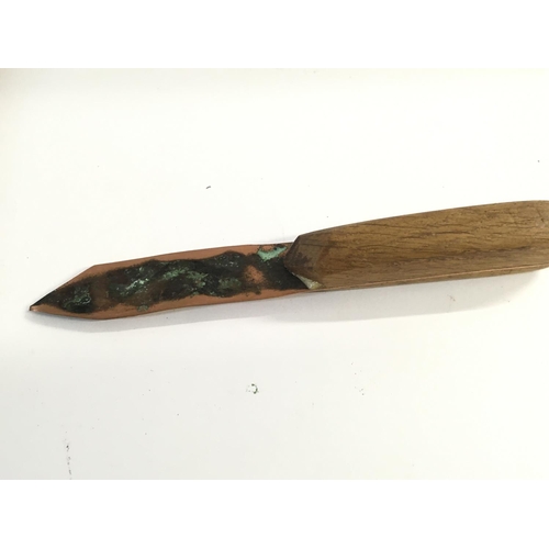 2128 - An oak and copper letter opener containing material from HMS Victory with a certificate provenance. ... 