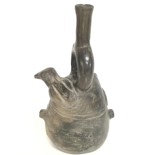 601 - Peruvian Pottery jug in the form of a head , approximately 24CM tall. Postage category B