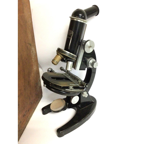 618 - A Carl Zeiss Jena model 265741 academic microscope with multiple attachments, with wooden carry case... 