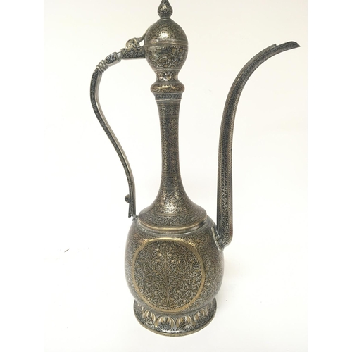 620 - A Quality white metal and silvered brass Middle Eastern Coffee pot with perfuse decoration height 44... 