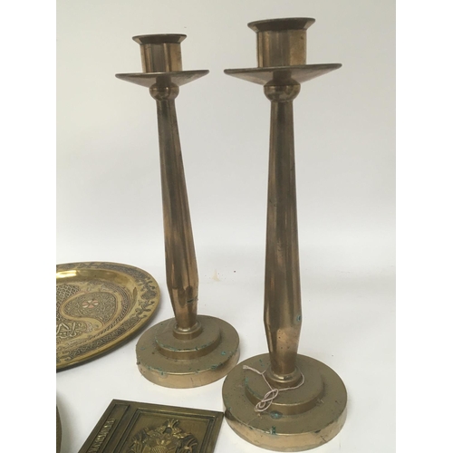 625 - A pair of gun metal modern design candle sticks two early 20th century brass printing blocks a horse... 