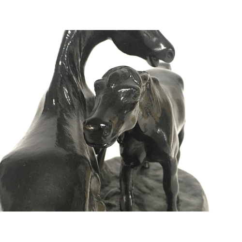 628 - A Soviet Russian black metal statue of two horses, approximately 24cm wide & 16cm tall. Postage cate... 