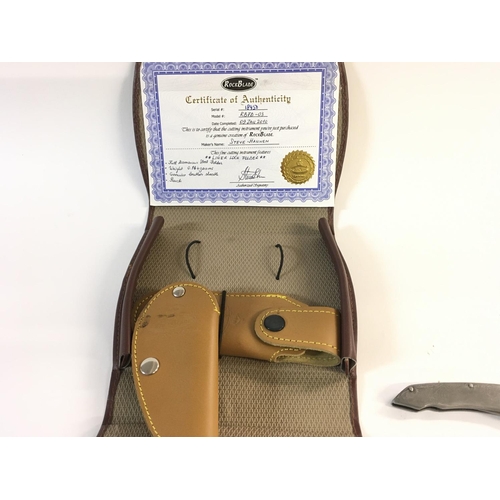 653 - A Damascus steel folding knife with leather sheaf and pouch. Comes with certificate of authenticity.... 