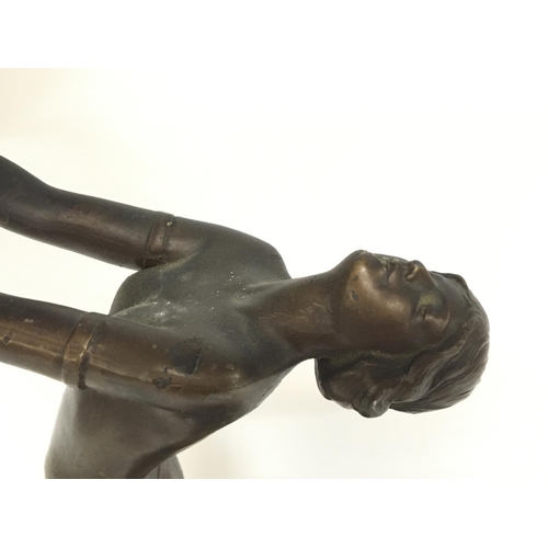 664 - An Art nouveau style Bronze electric lamp featuring a figure of a lady supporting the shade (damaged... 