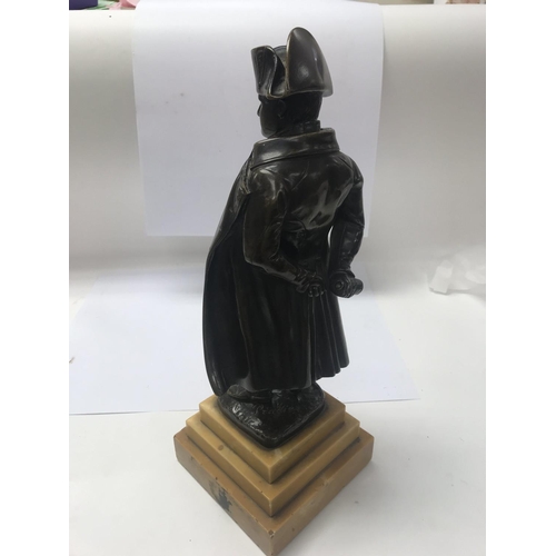 671 - A bronze figure of Napoleon on a stepped marble base. 36cm in height