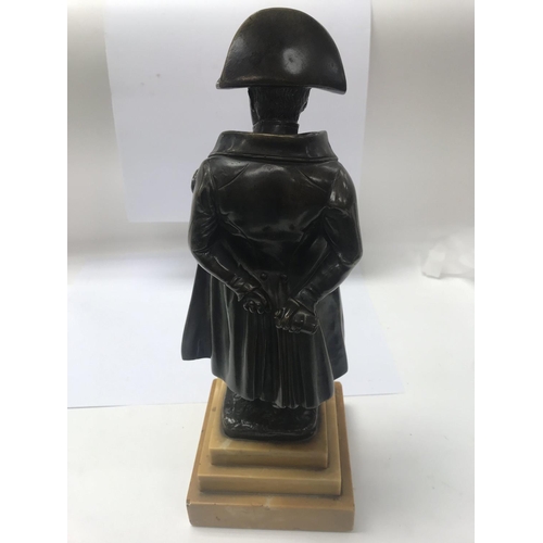 671 - A bronze figure of Napoleon on a stepped marble base. 36cm in height