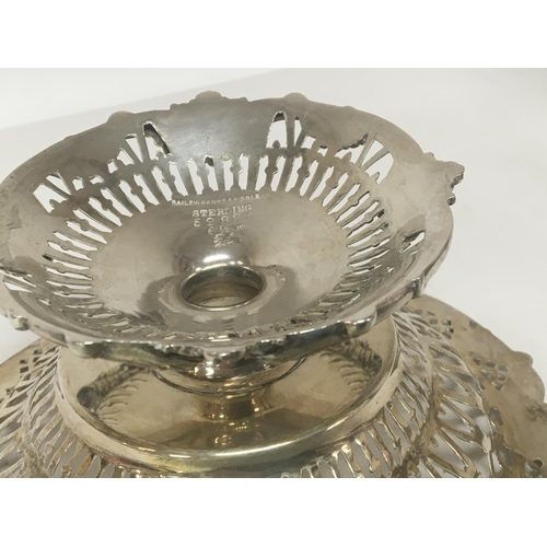 695 - A Sterling silver dish with pierced decoration and Scrolls diameter 17cm