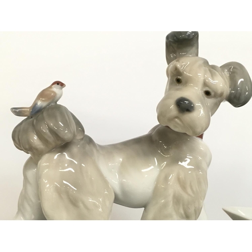 804 - A collection of boxed Lladro porcelain Dog figurines , no obvious damage or restoration. Postage cat... 