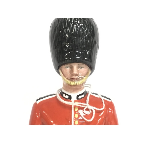 818 - Royal Doulton The Guardsman & The Lifeguard porcelain figures. Approximately 15cm tall. Postage cate... 