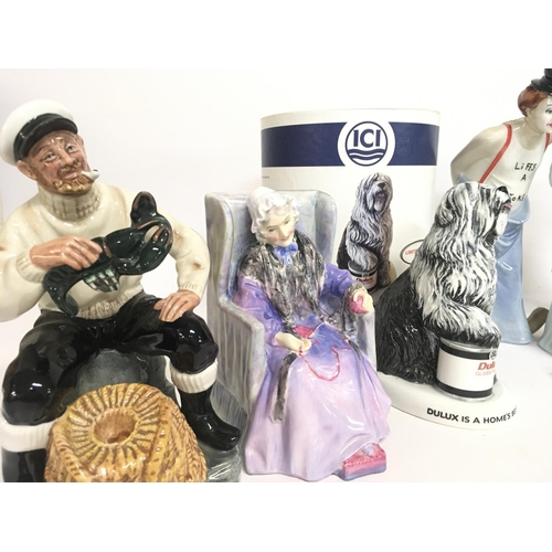 844 - A collection of Royal Doulton Porcelain figures including The Lobster Man HN2323, Joan HN2023, Dulux... 