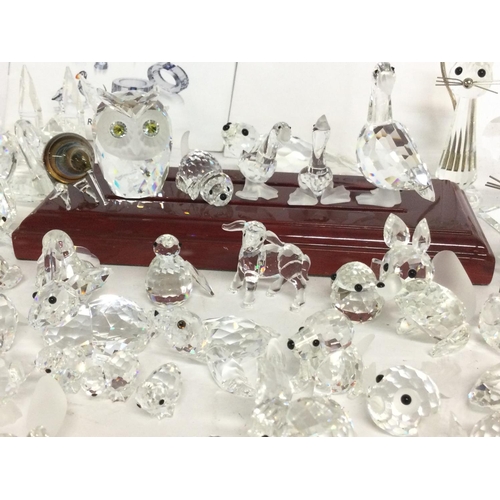 849 - A large collection of various crystal miniature figures including Swarovski, some damage. Postage ca... 