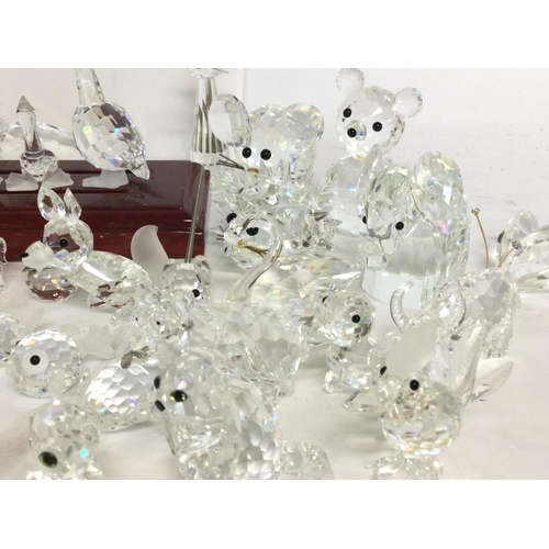 849 - A large collection of various crystal miniature figures including Swarovski, some damage. Postage ca... 