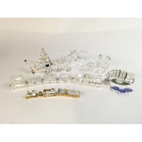 851 - A large collection of Swarovski silver crystal figures as pictured, containing trains, animals, Chri... 